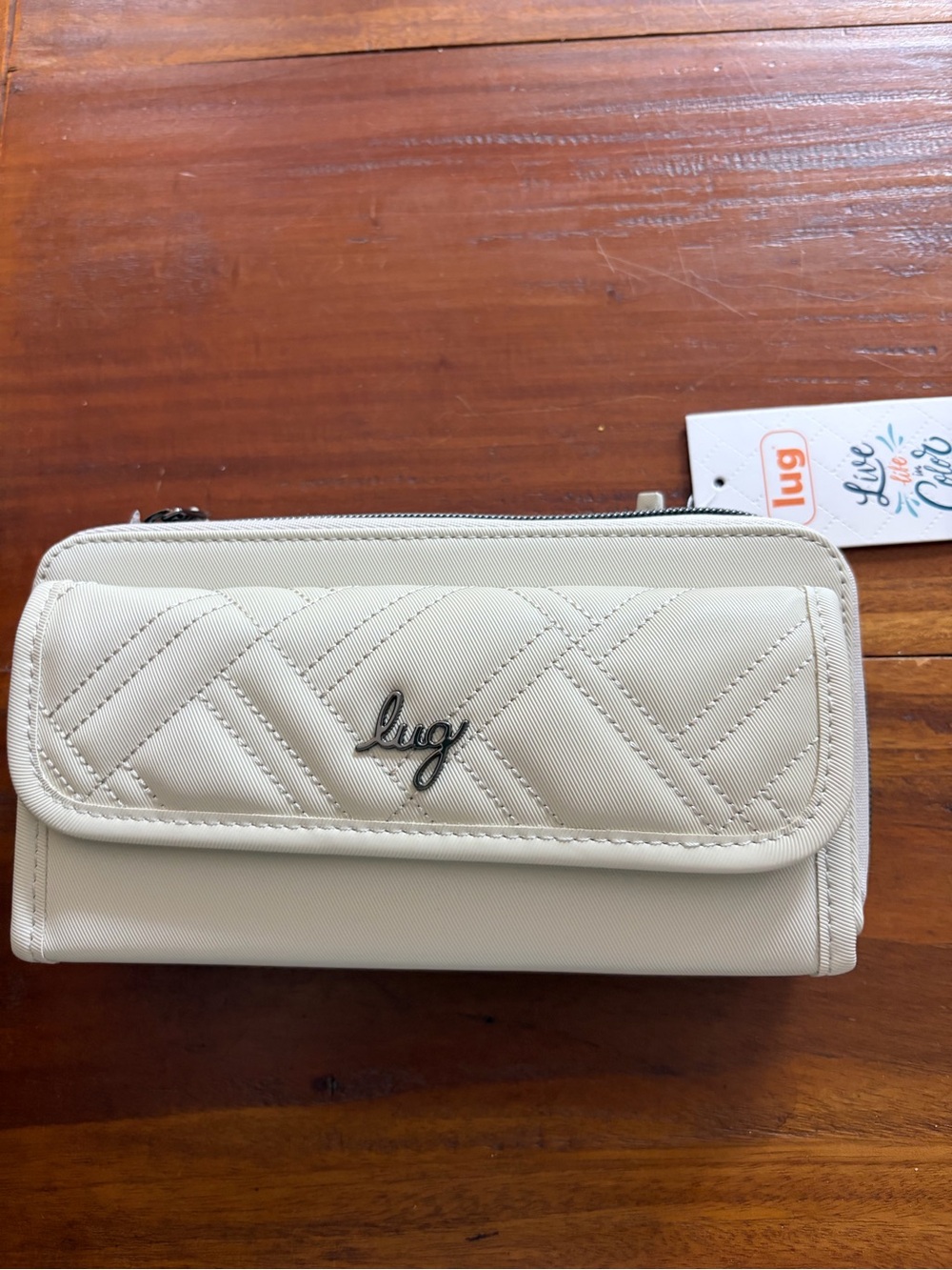 lug Quilted Cream Crossbody Wallet with Front and back zipper pockets.